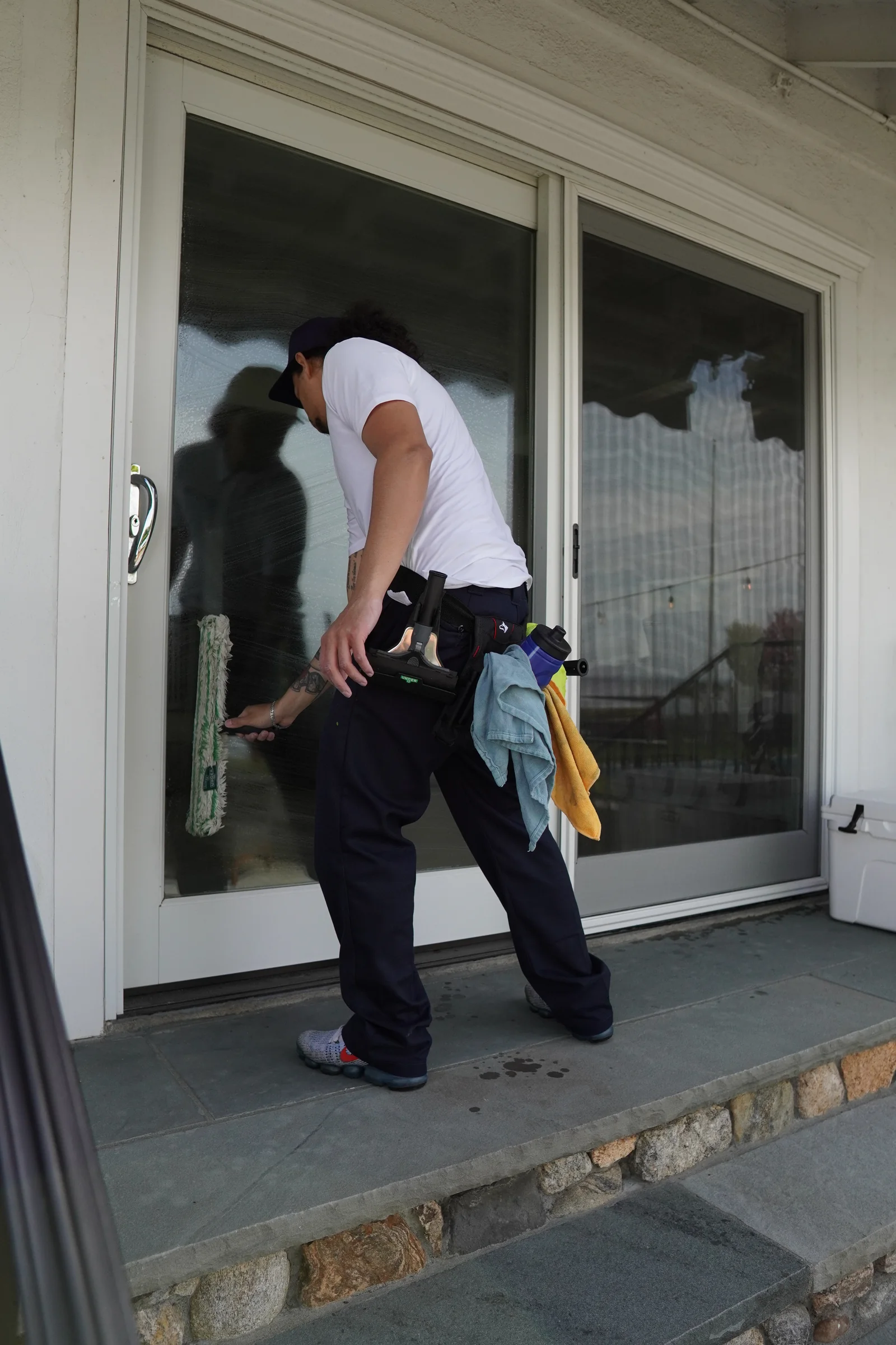 Sliding glass door cleaned by hand at a client's home