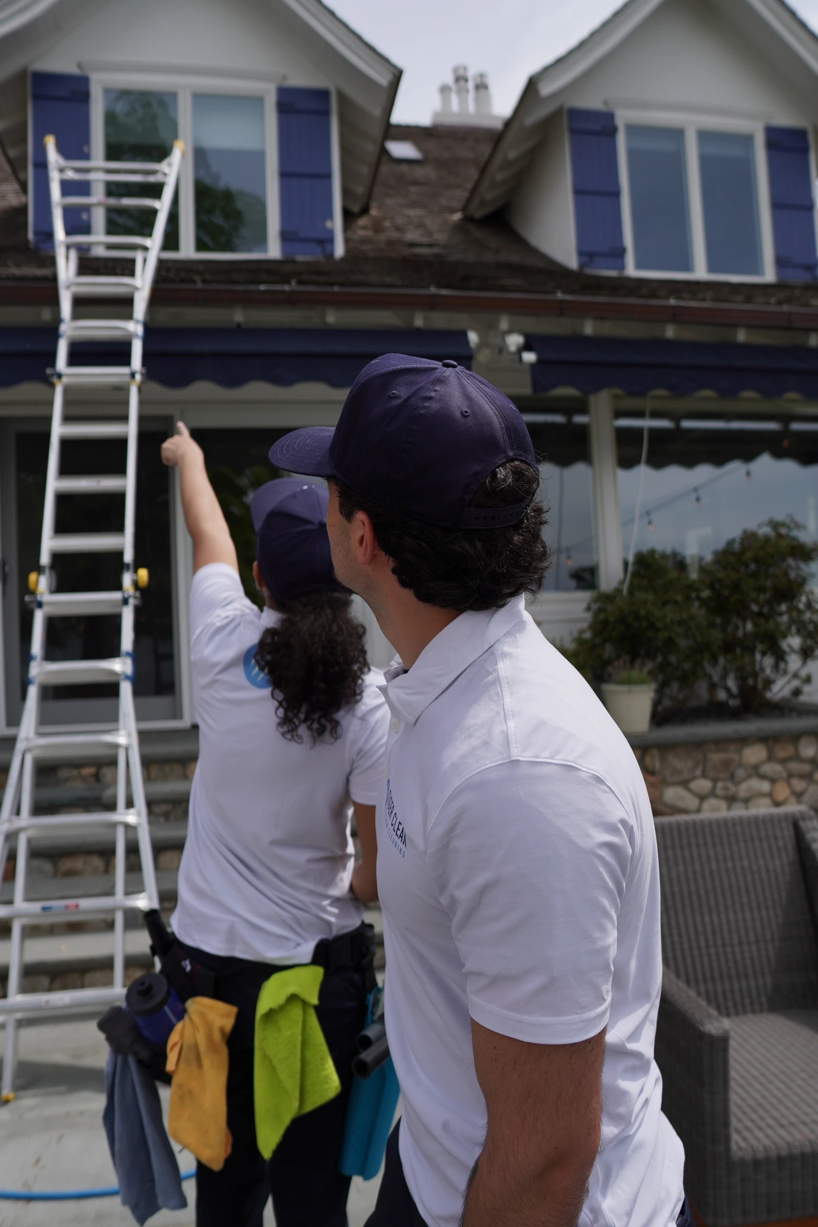 The Tiger Clean team in white uniforms at a residential property