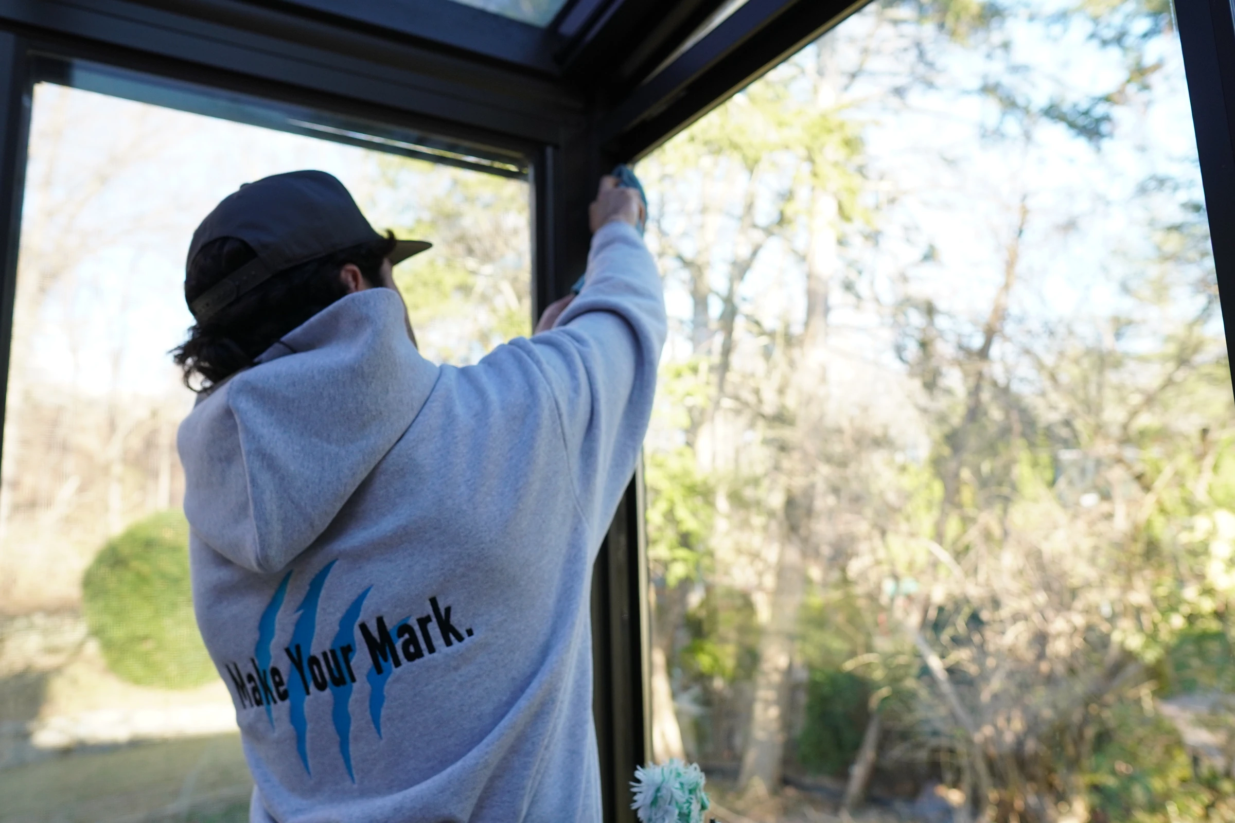 Interior glass cleaned from inside a sunroom