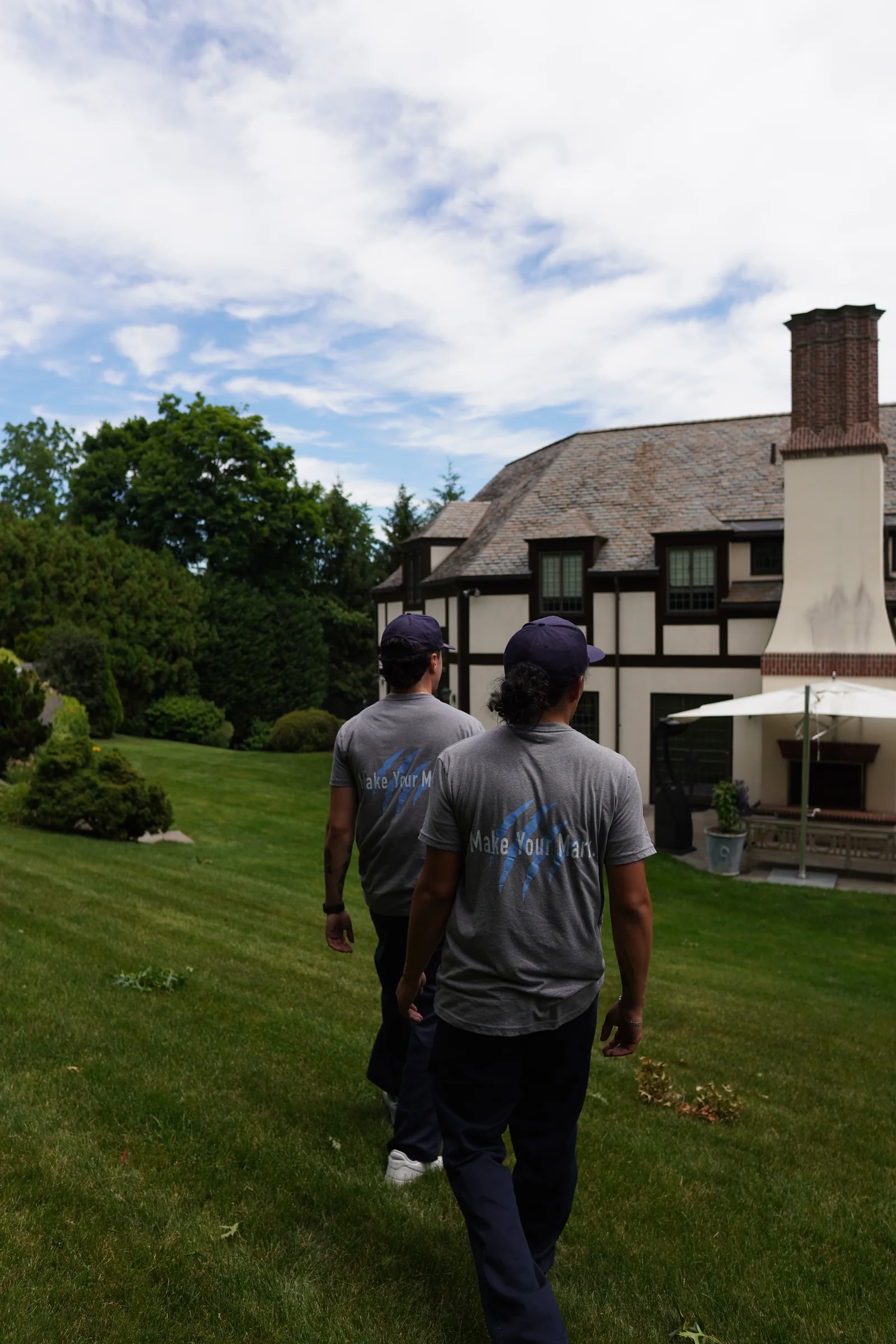 Tiger Clean technicians in grey uniforms working a property